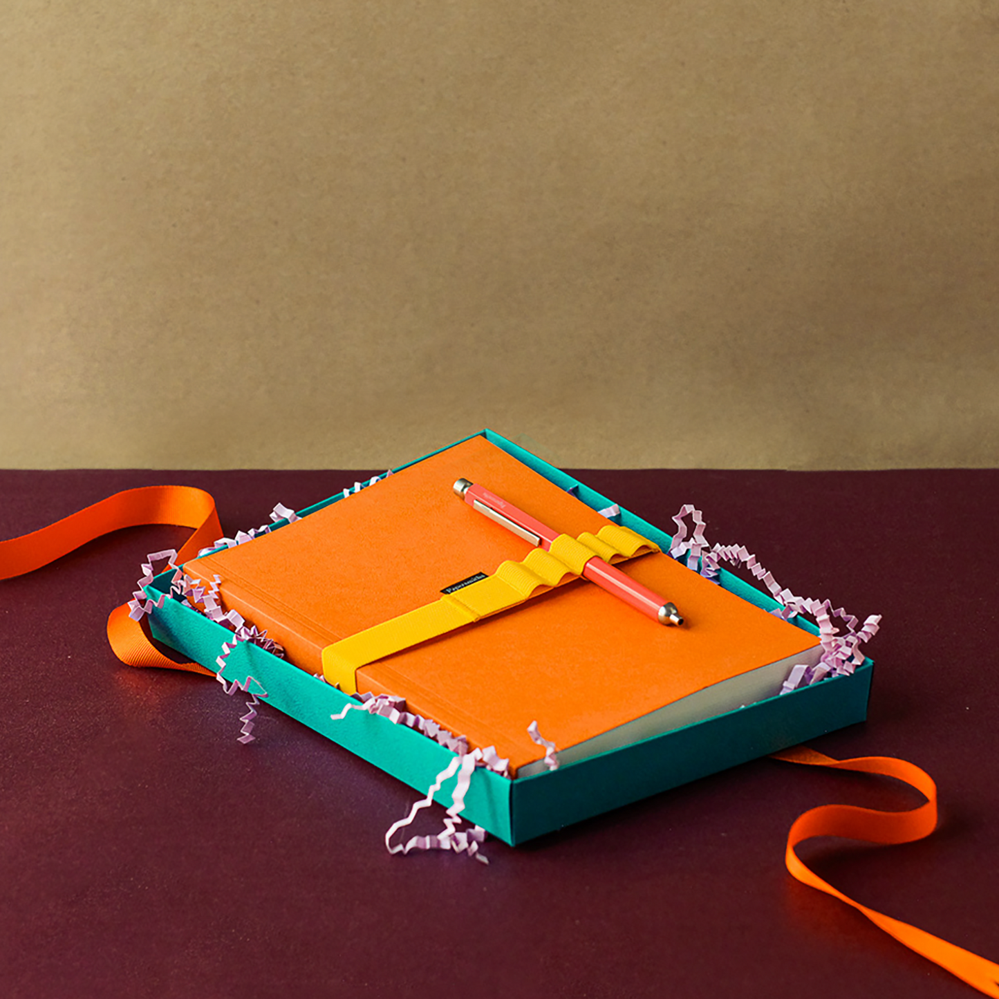 Orange notebook and pen stationery set