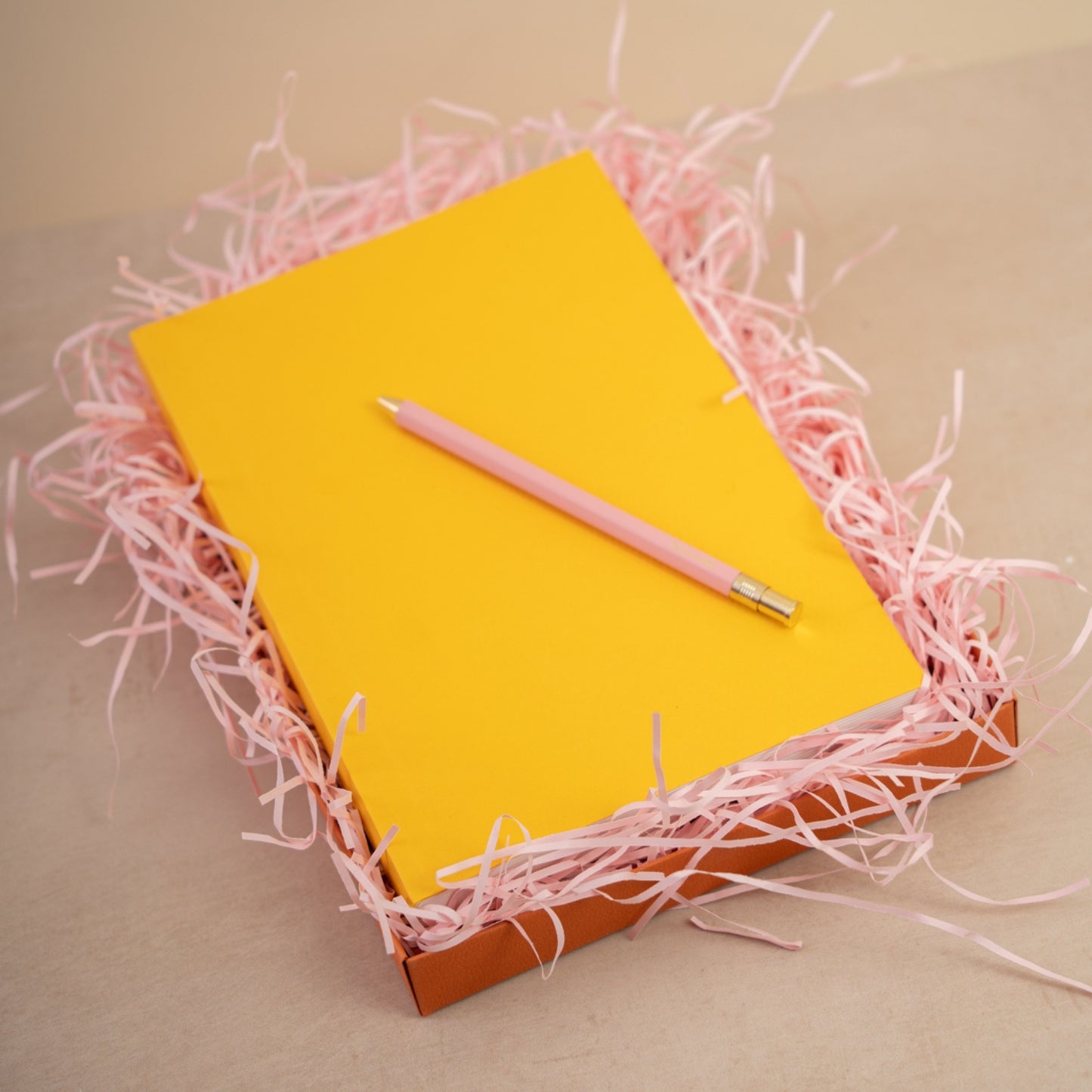Yellow notebook and pink pen gift set