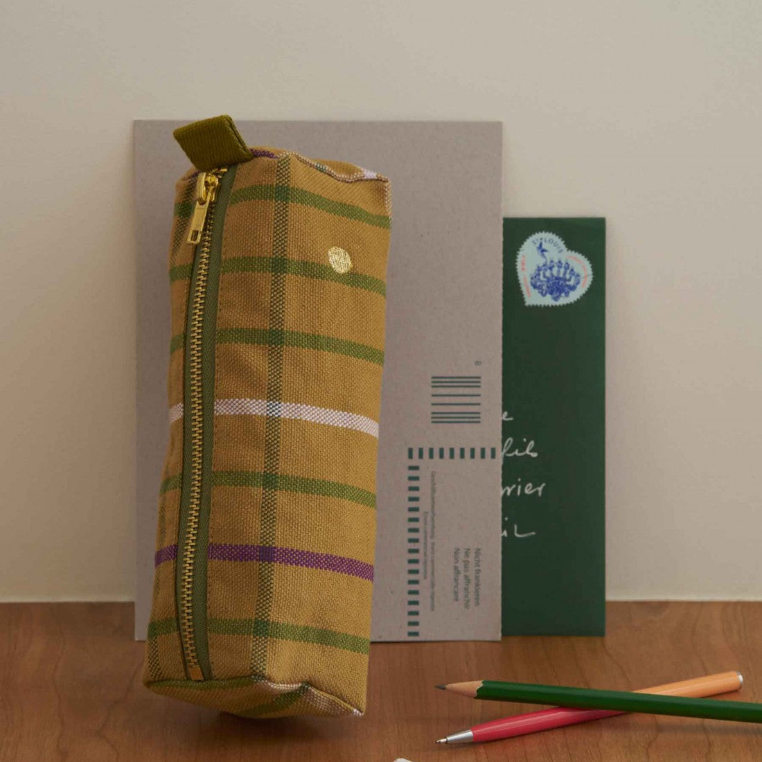 Plaid pencil case, waterproof and colourful design.