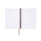Spiral-bound planner with white pages on a white background