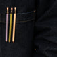 3 pocket-sized pencils clipped to a denim pocket