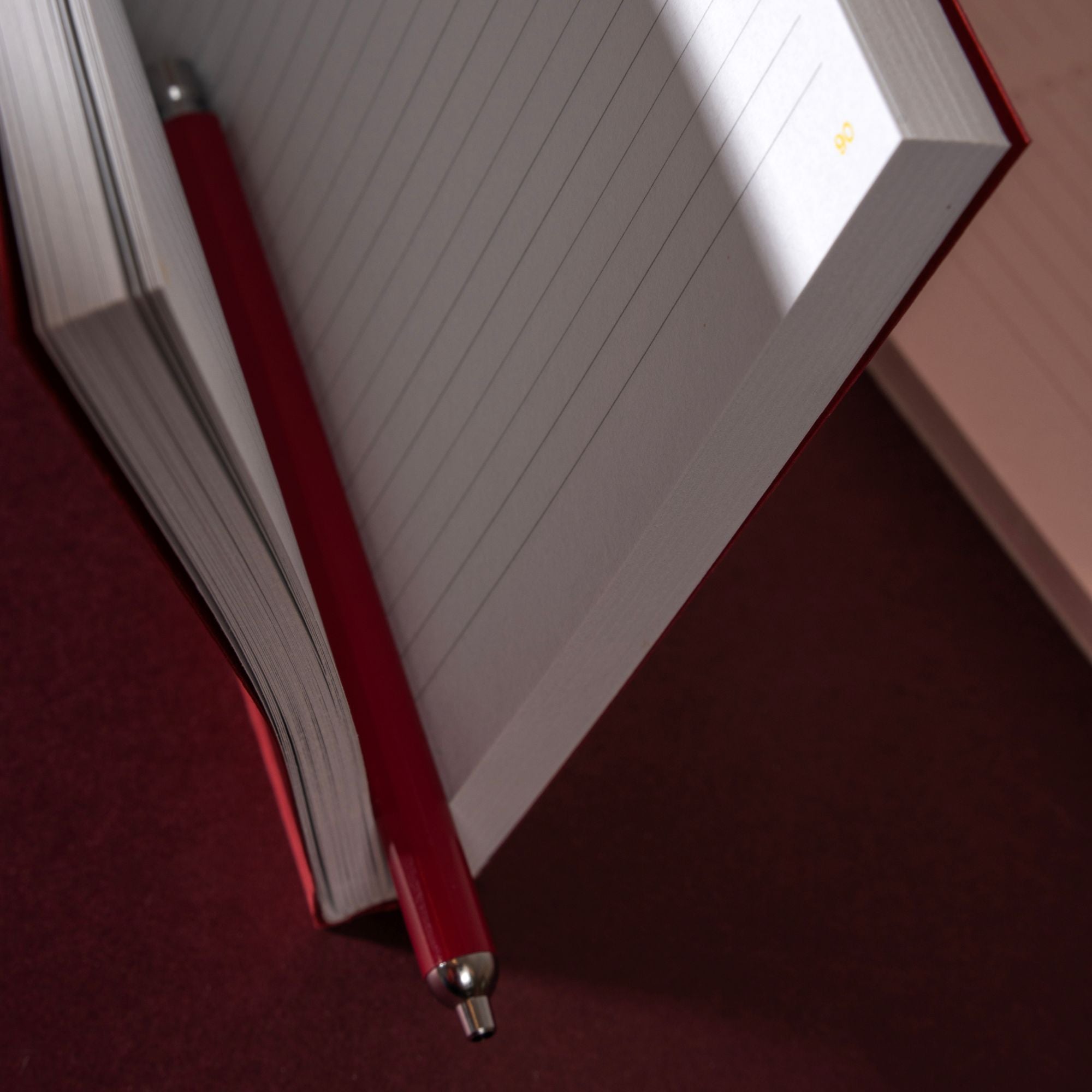 red pen in notebook