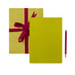 Lime gift box with red ribbon and pen on a white background