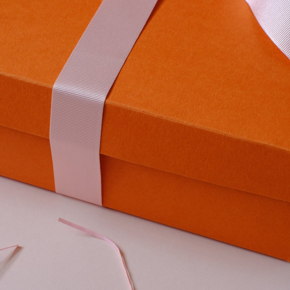 Pink Ribbon on Orange Box