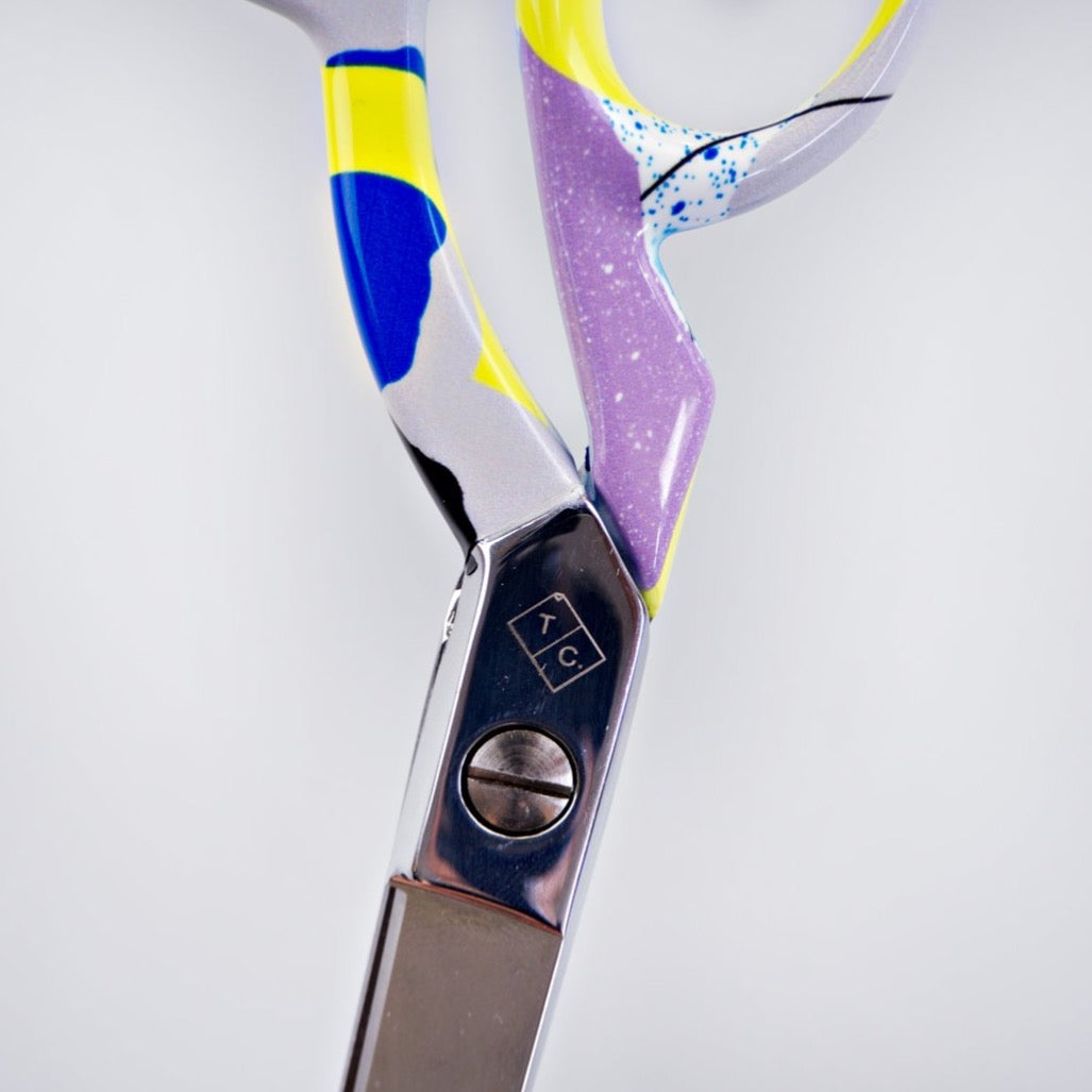 The completist scissors logo